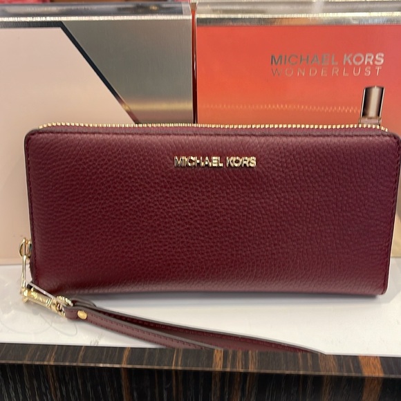 MICHAEL KORS
Leather Continental Wristlet Phone Case Wallet 
Oxblood 
NWT 
M - Picture 14 of 16